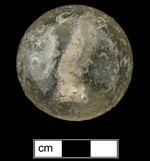 18BC80 - Front and side views of sulphide marble with an owl figurine. There is much damage to the surface of this marble, suggesting it was well-used - click on image to see larger view.